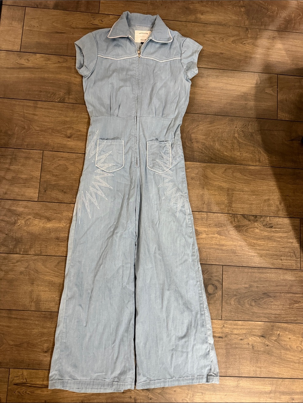 Understated Leather Sunburst Jumpsuit